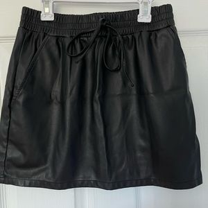 Black leather mini skirt